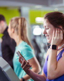 Family enjoying fitness at The Anner Hotel gym, using treadmills together.