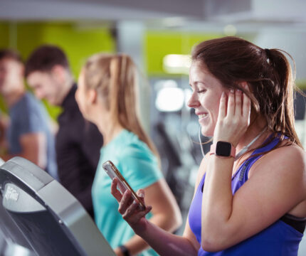 Family enjoying fitness at The Anner Hotel gym, using treadmills together.