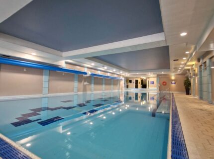 Indoor pool at The Anner Hotel with serene lighting and inviting atmosphere.